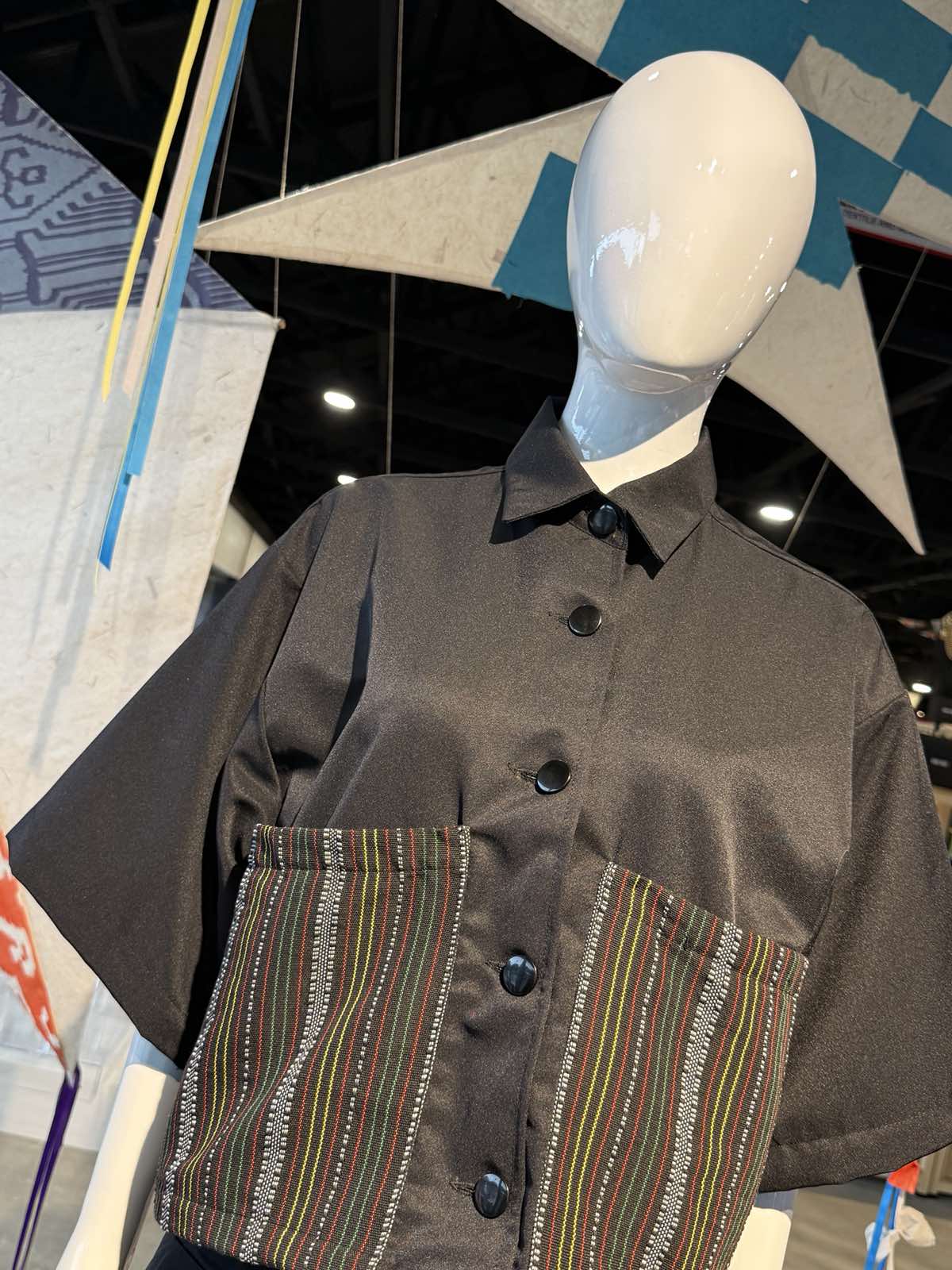 Black top with oversized pockets from Cordillera Couture